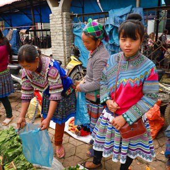 Vibrant traditional market scene in Lào Cai, Vietnam showcasing local ethnic attire.