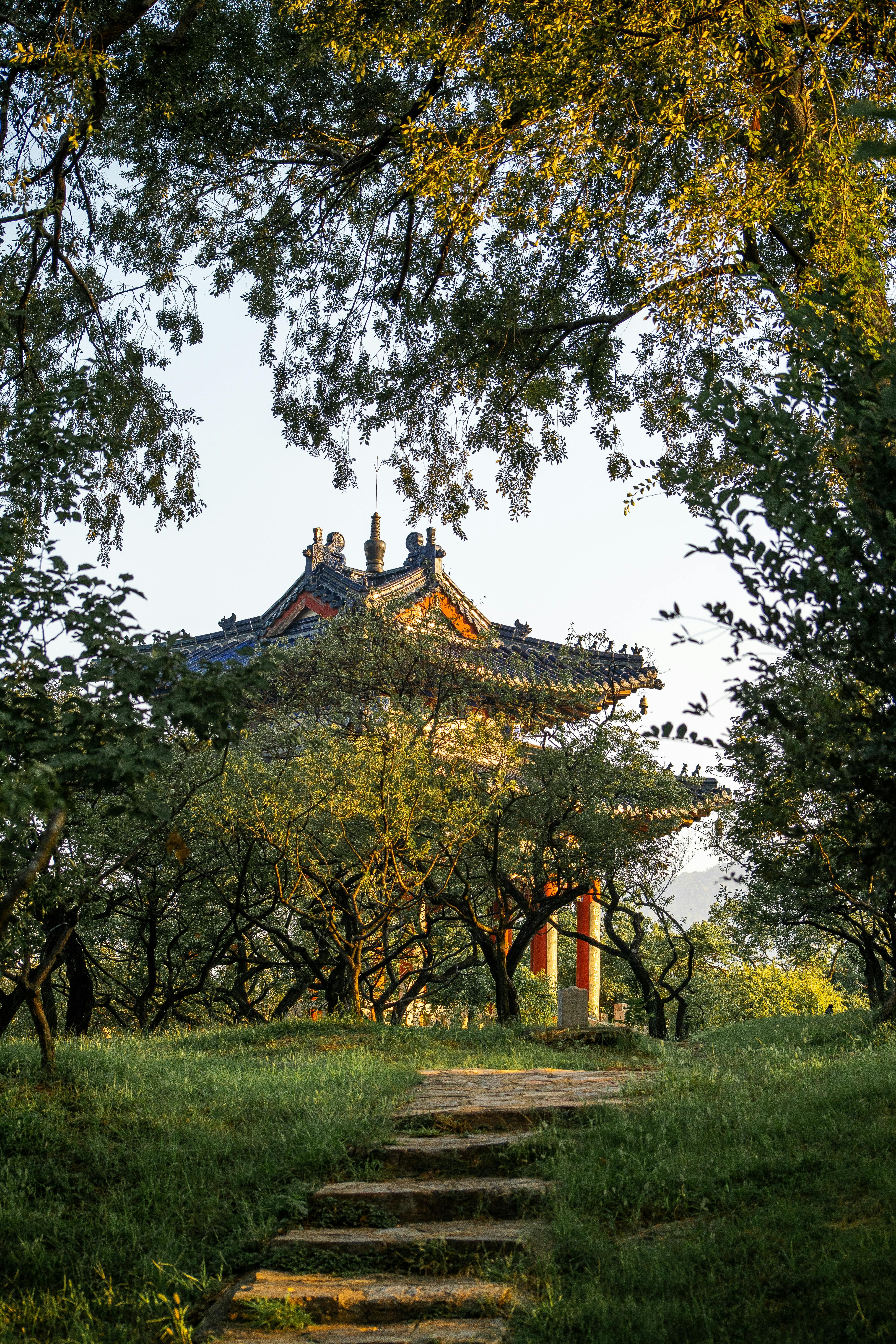 Beautiful landscaped park with a traditional Chinese pavilion in Nanjing during daytime.