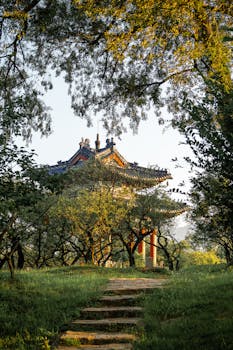 Beautiful landscaped park with a traditional Chinese pavilion in Nanjing during daytime.