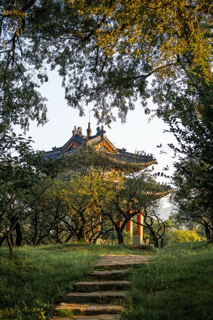 Beautiful landscaped park with a traditional Chinese pavilion in Nanjing during daytime.
