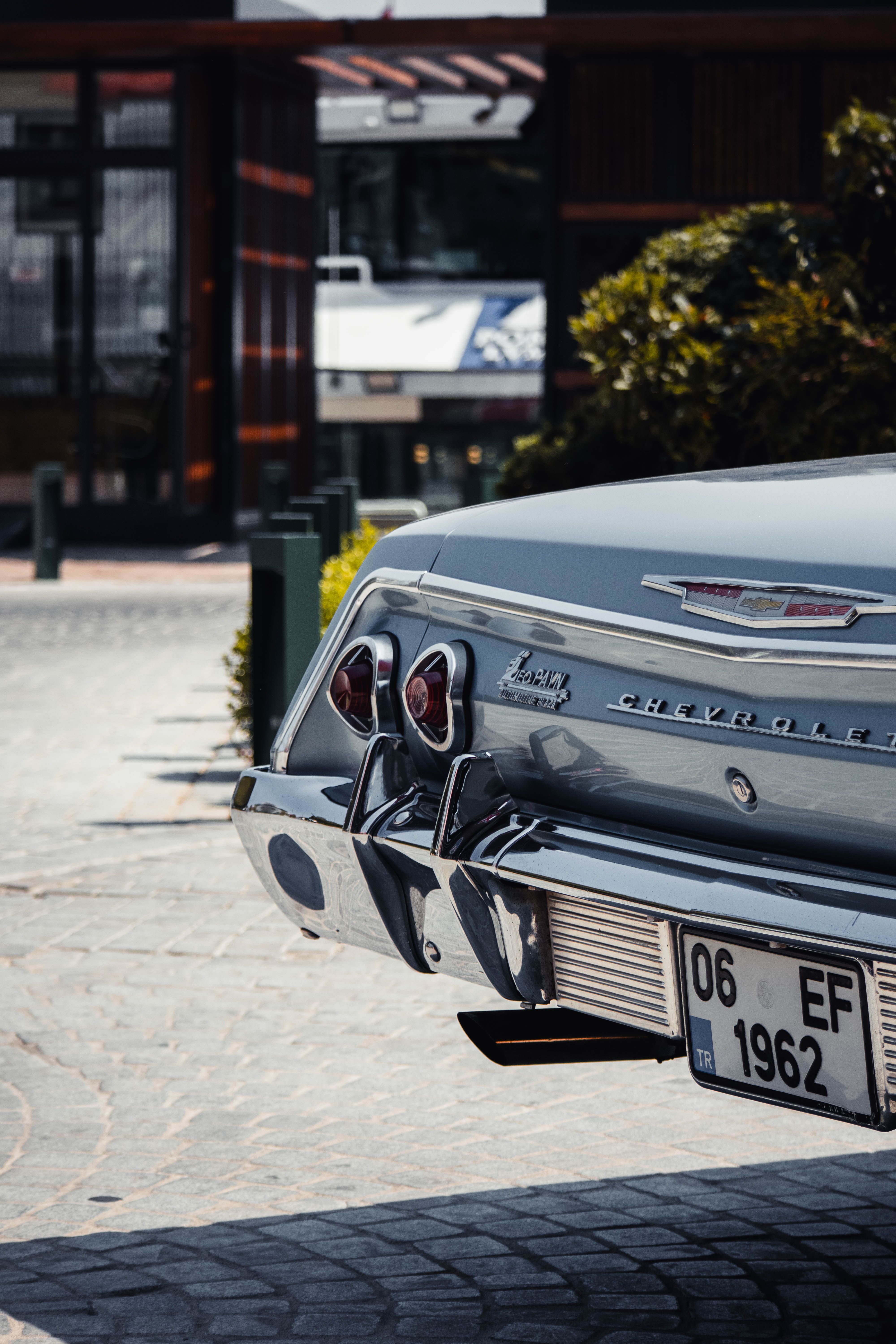 Rear View of Green Vintage Chevrolet Impala Car · Free Stock Photo