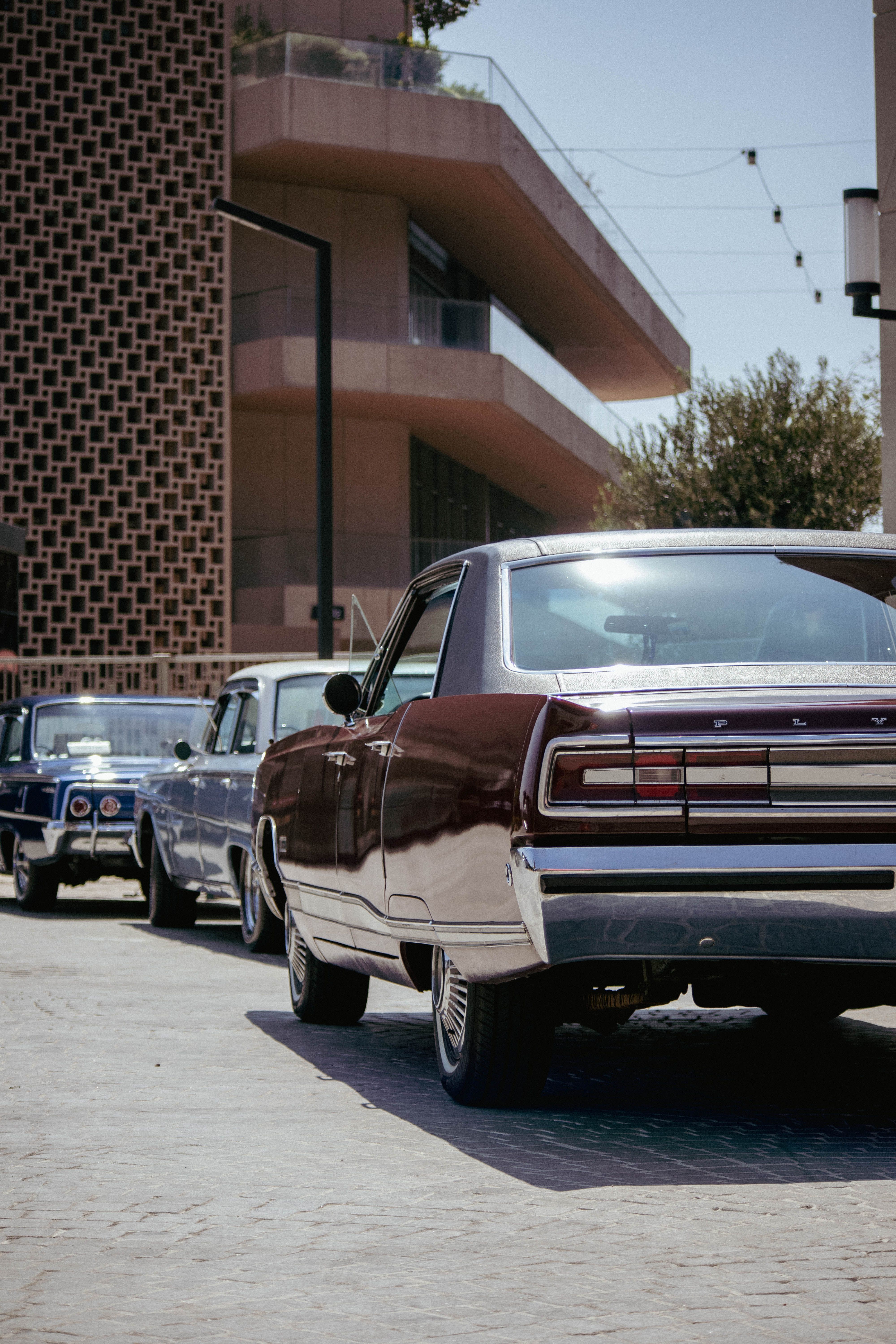 A lineup of vintage cars on an Istanbul street, showcasing classic automotive design.