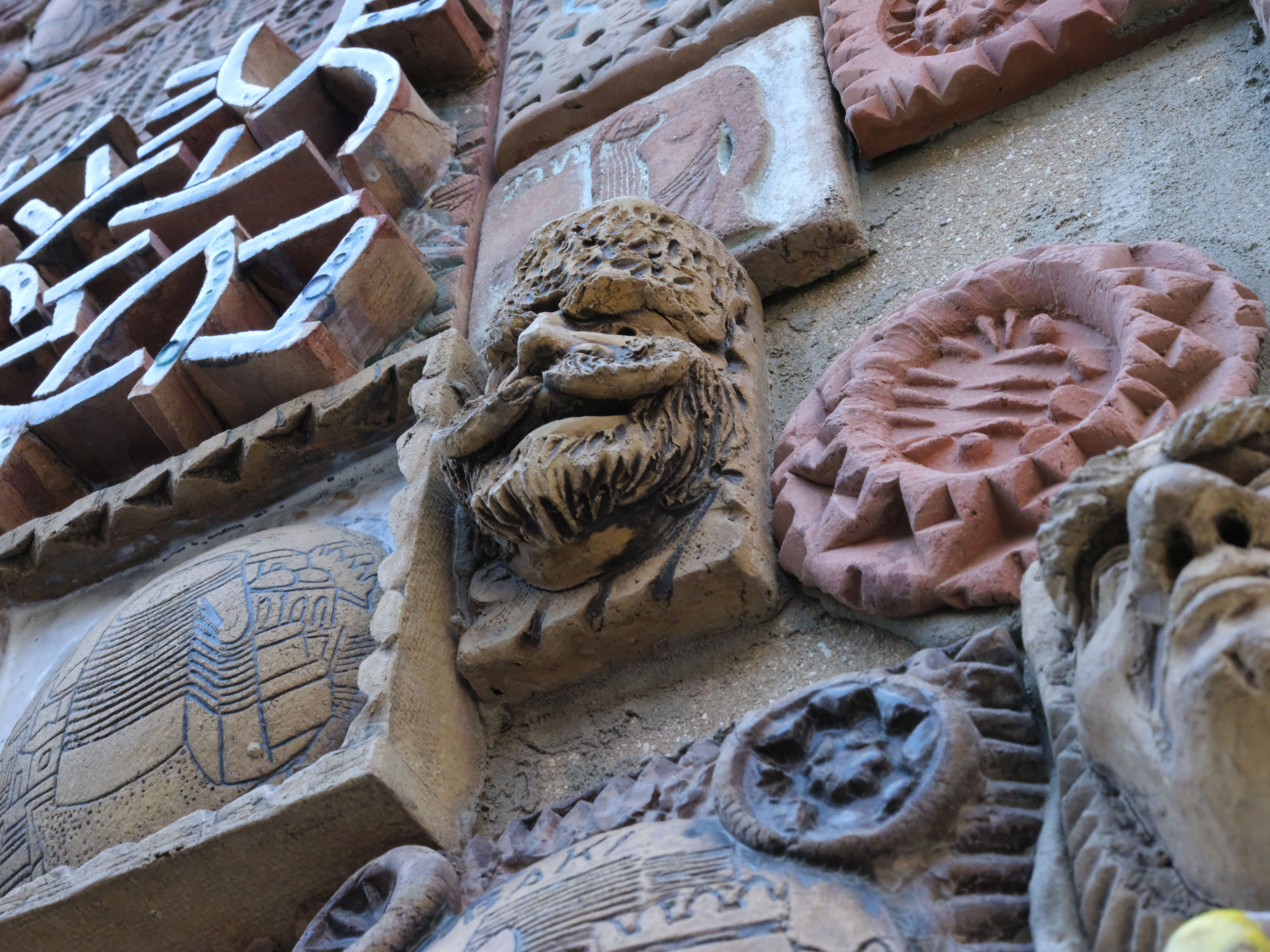 Intricate architectural wall with carvings, Benin