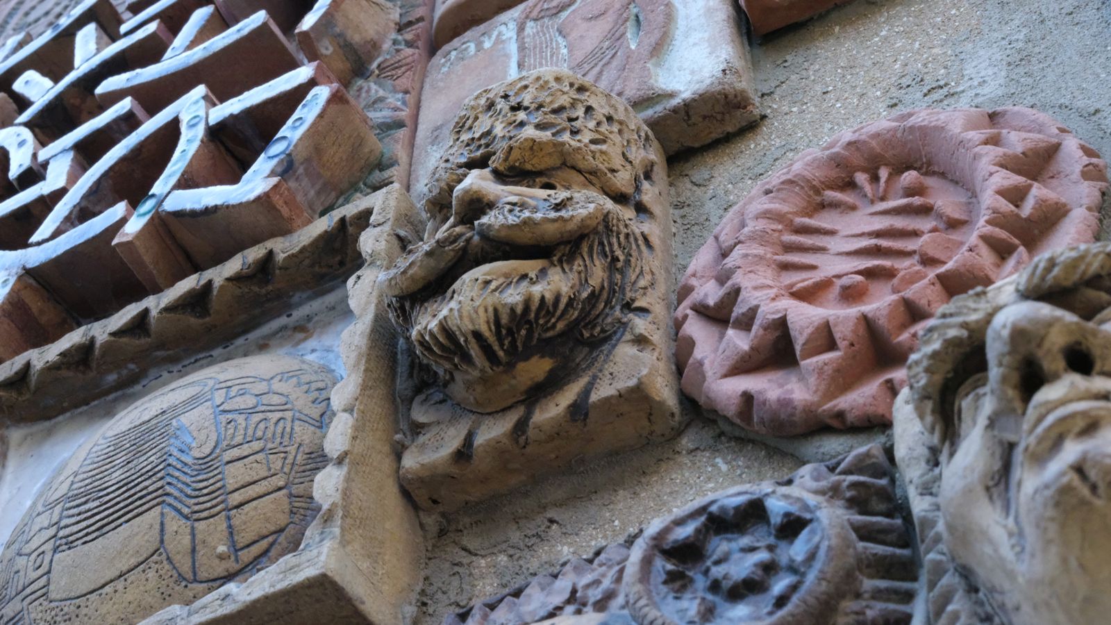 Intricate architectural wall with carvings, Benin