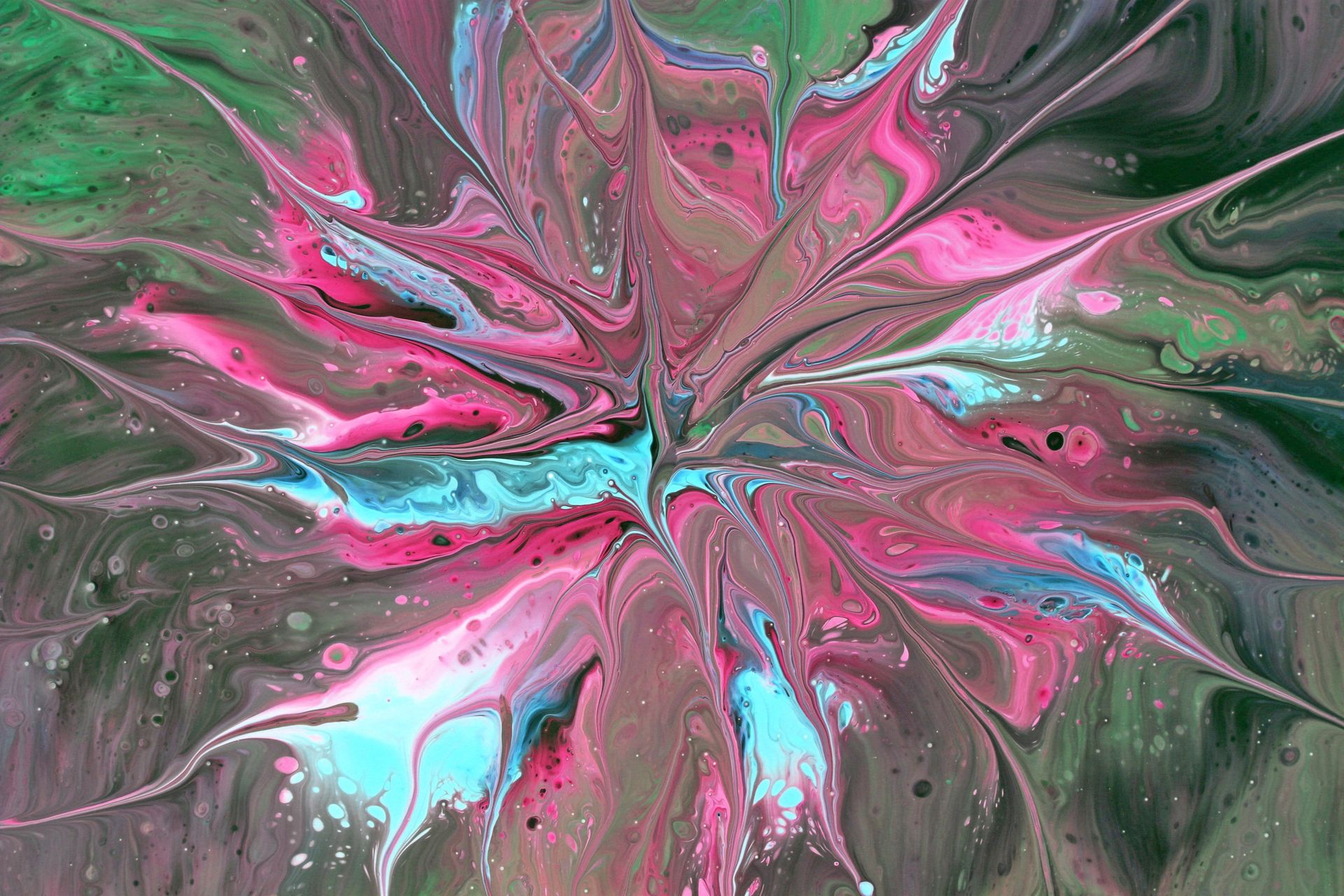 Dynamic abstract fluid art showcasing vibrant pink and blue swirls with a captivating starburst pattern.