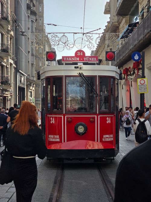 Free Red historic tram on busy Istiklal Avenue in Istanbul, Turkey. Stock Photo