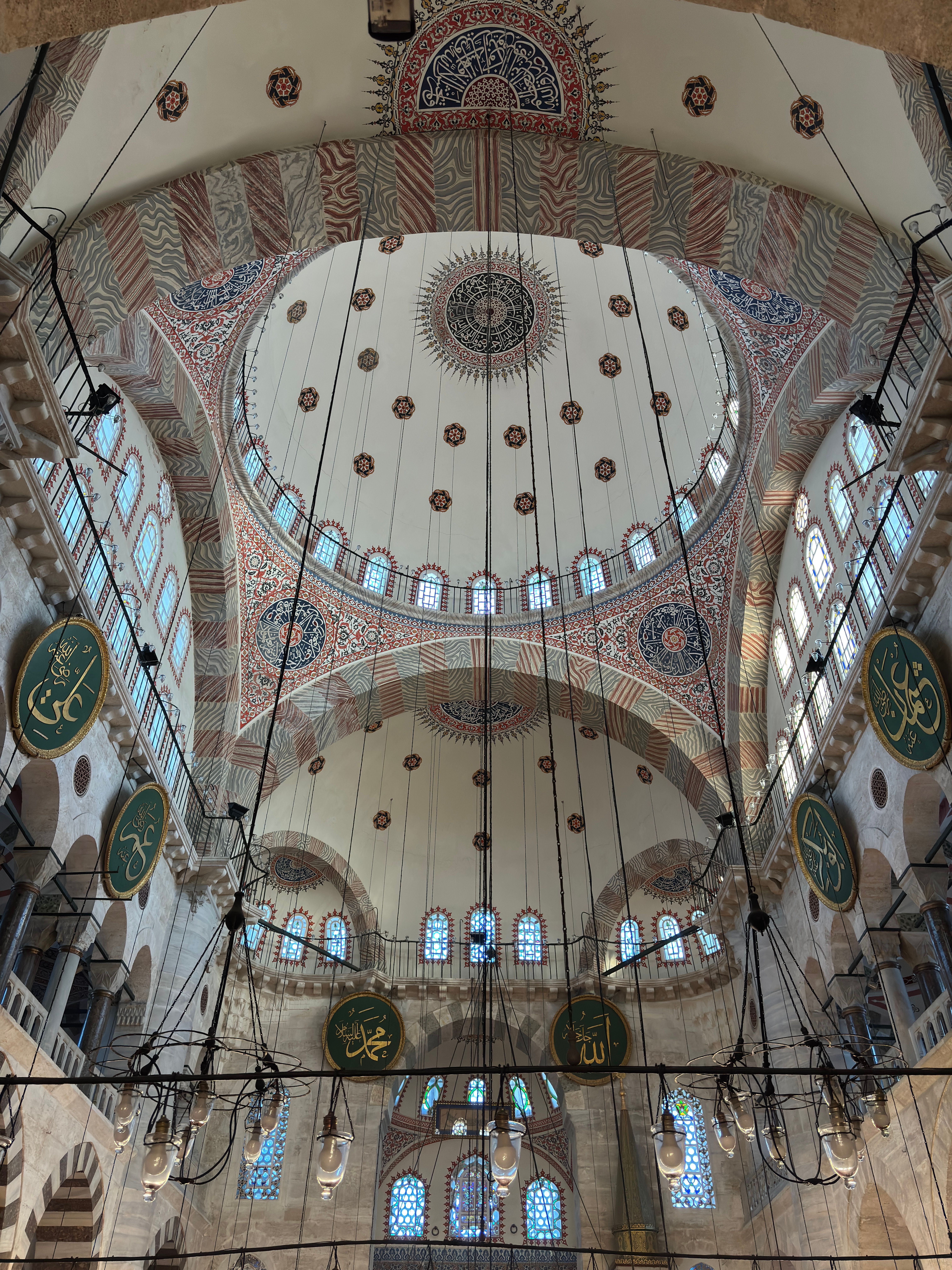 Captivating interior view of a historic mosque in Istanbul with ornate architectural features.