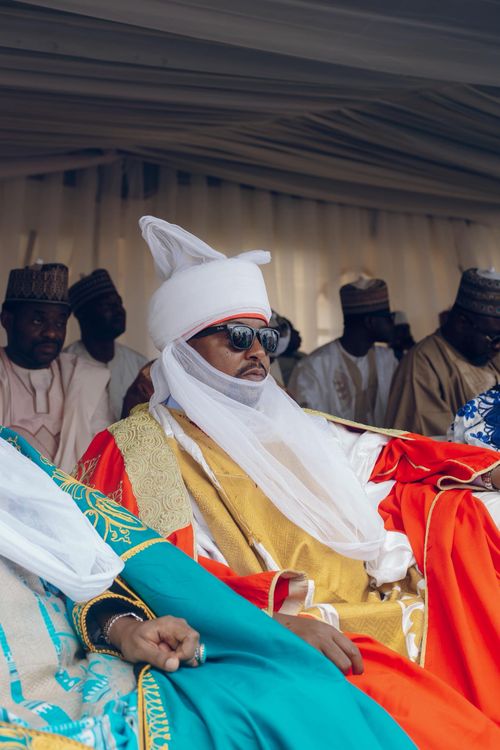 Free Man in traditional African regalia at a cultural ceremony, exuding elegance. Stock Photo