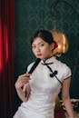 Elegant Woman in Traditional Cheongsam Dress