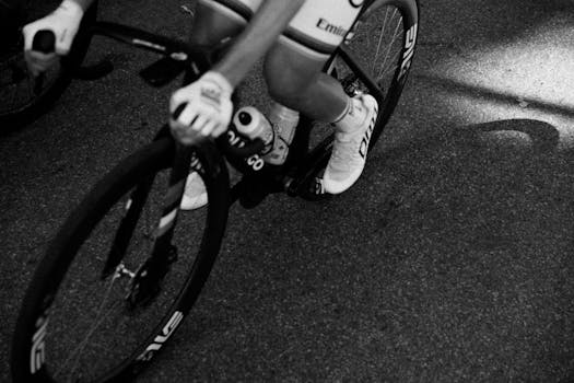 Cyclist in motion captured in a striking black and white scene, highlighting speed and intensity.