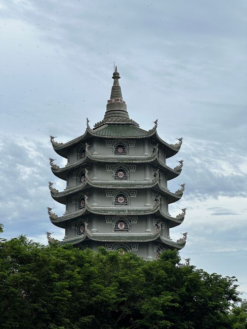 Free Elegant multi-tiered pagoda amidst lush greenery in Đà Nẵng, Vietnam. Stock Photo