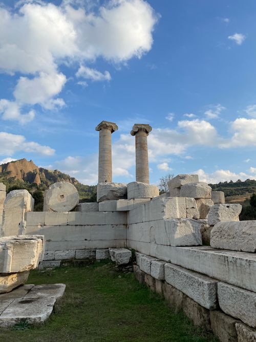 Free Explore historic ruins with tall columns under a vivid blue sky. Stock Photo