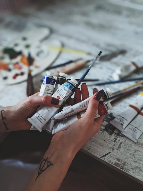 Free Person Holding Acrylic Paints Stock Photo