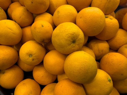 Free Vibrant orange fruits showcasing freshness and organic nutrition on display. Stock Photo