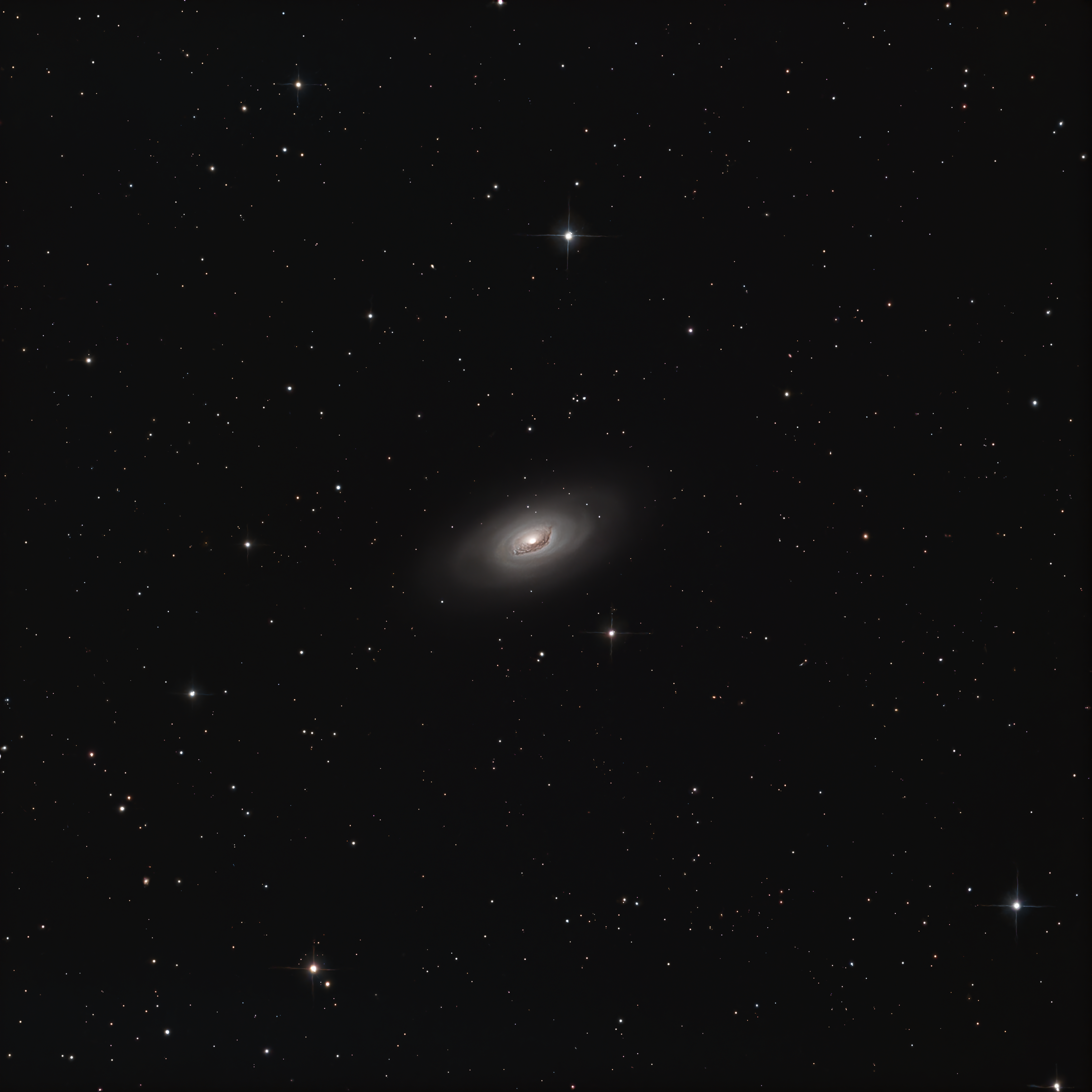 A stunning view of a spiral galaxy amidst a field of stars, showcasing the vastness of space.