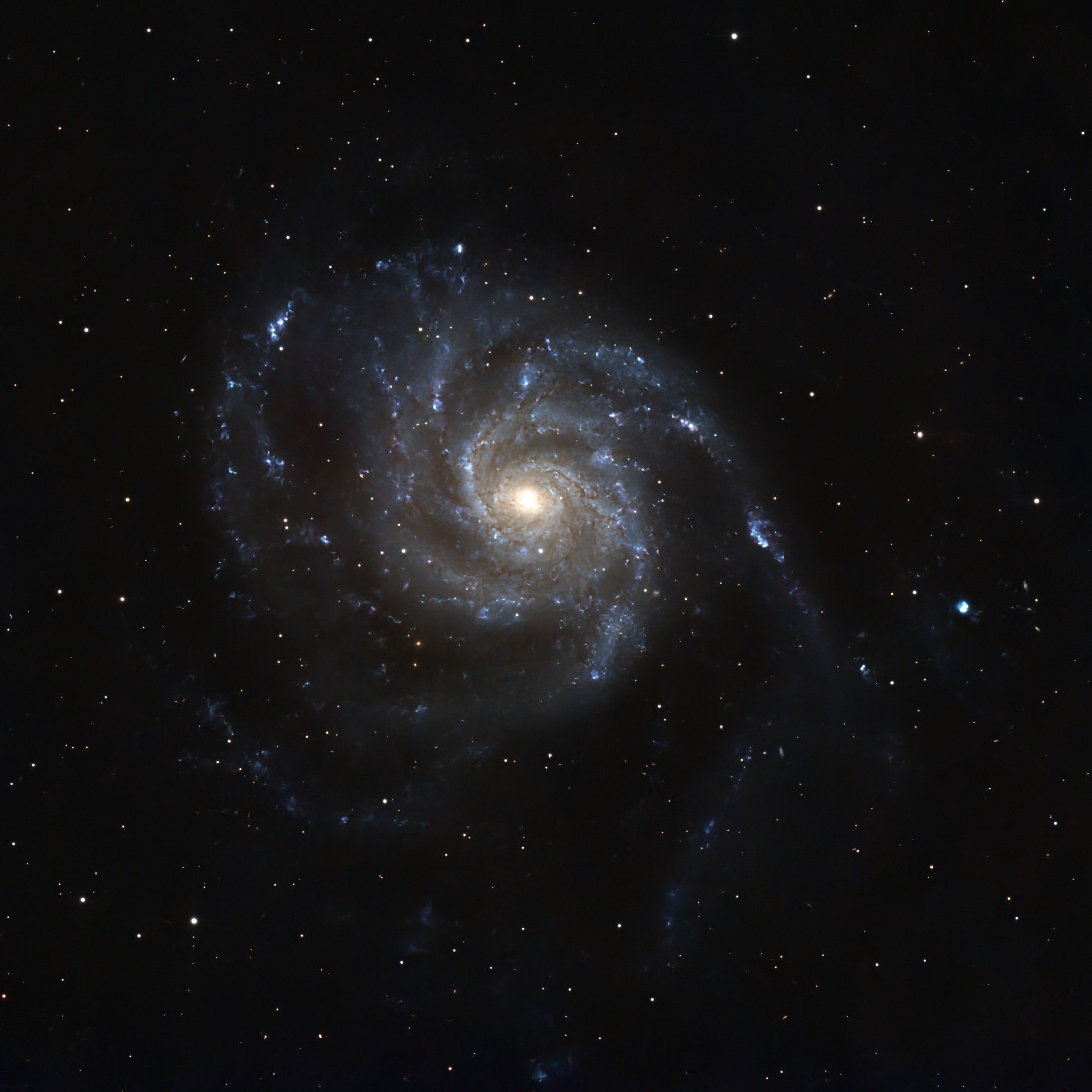 A mesmerizing view of a spiral galaxy showcasing its intricate arm structure and central glowing core.