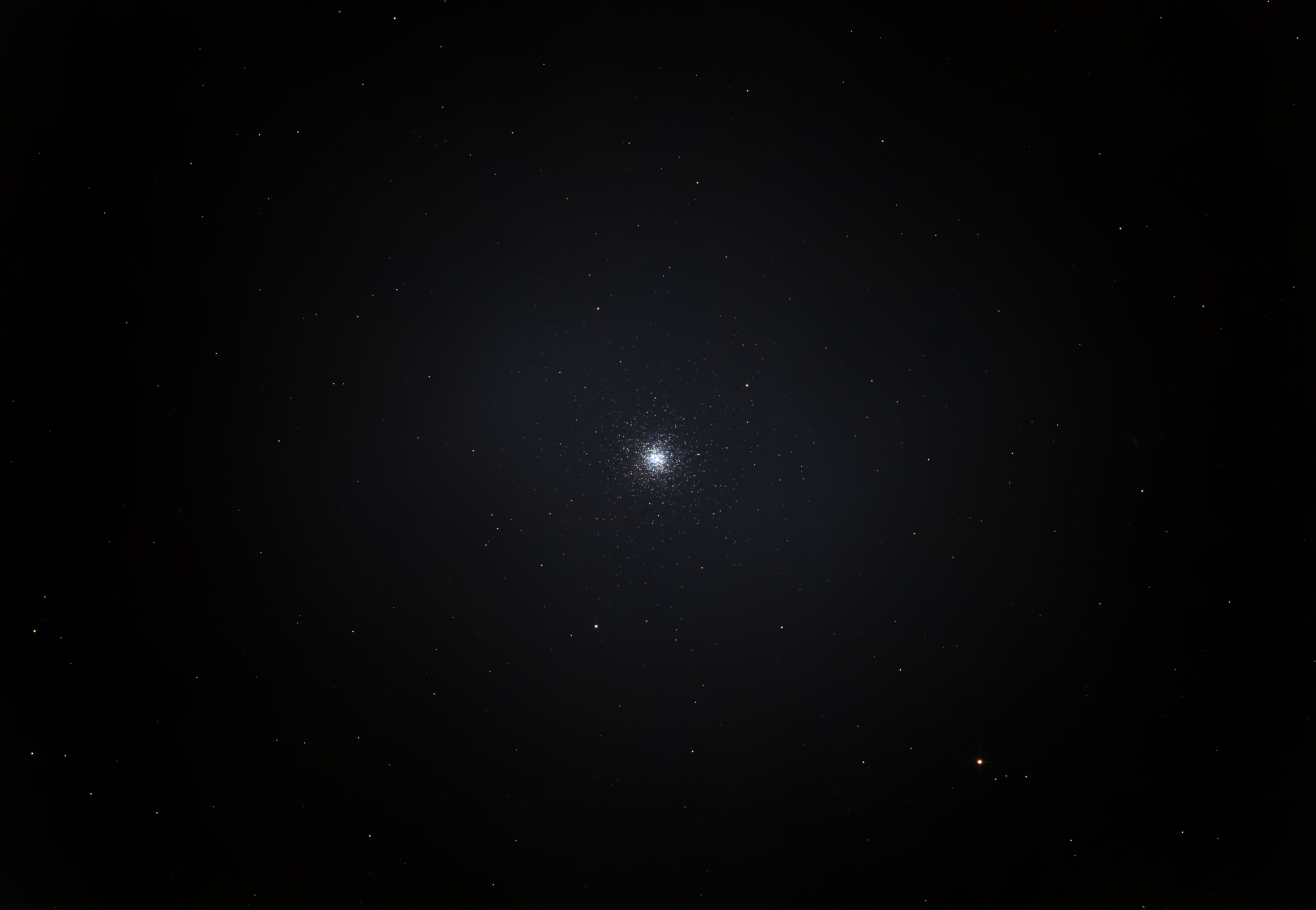 A mesmerizing view of a bright star cluster against a backdrop of the dark universe.