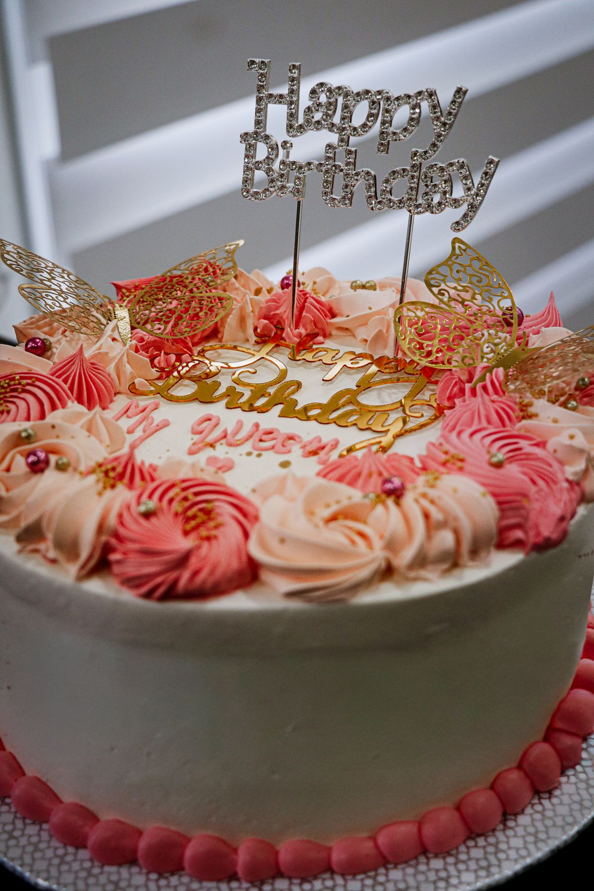 Hoorain Atelier custom celebration cake with pink and gold decoration
