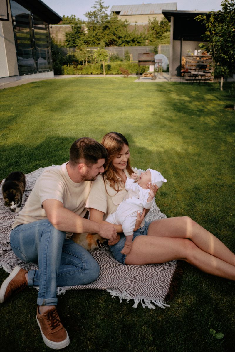 A young family enjoying time in their backyard garden