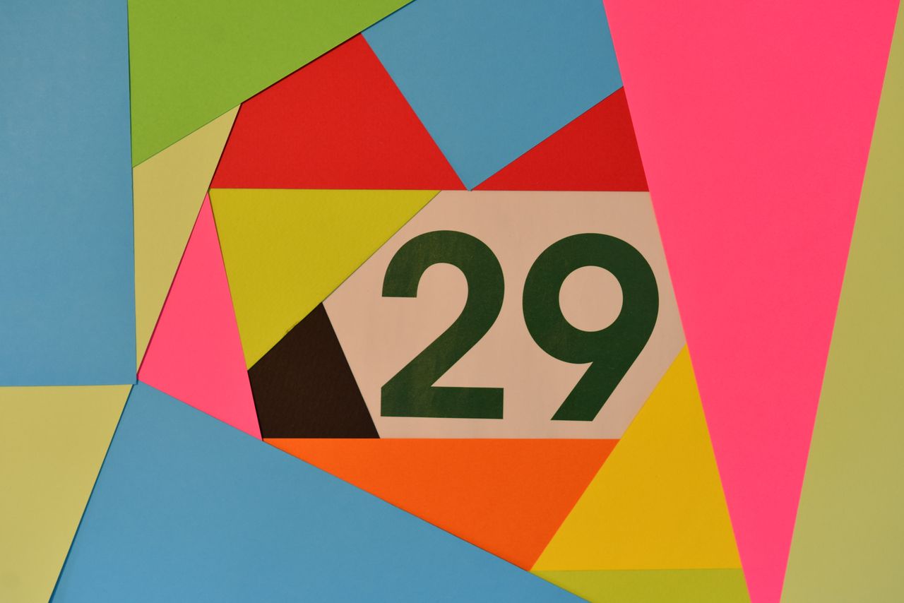 vibrant geometric shapes with the number 29 in the center set against