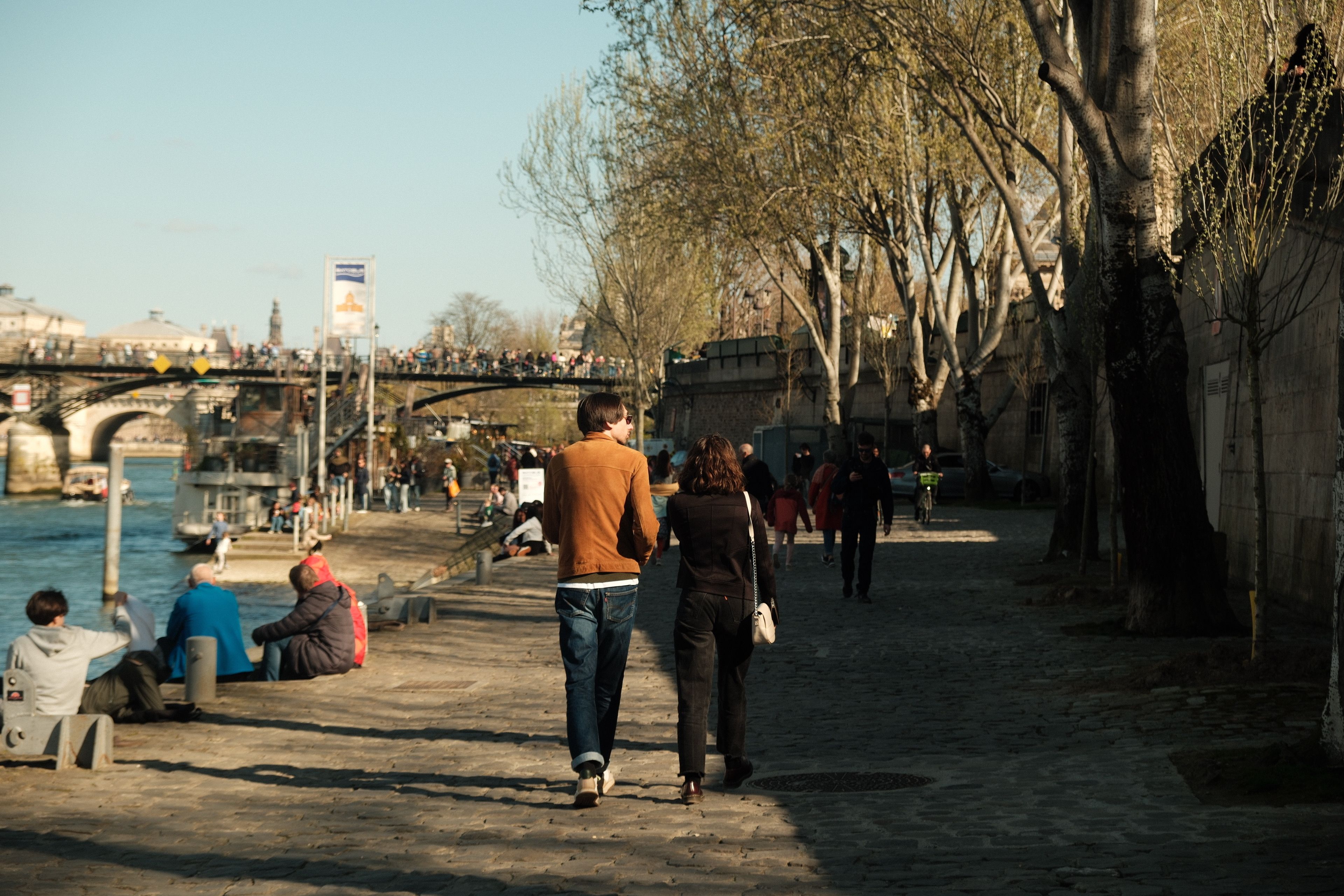 Visitors exploring pedestrian-friendly areas under Paris Tourism and Mobility Initiatives