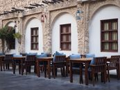 Beautiful outdoor cafe with arch windows in Doha, Qatar. Perfect for a cozy ambiance.