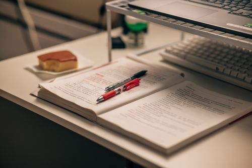 Open book and notes prepared for manuscript publication