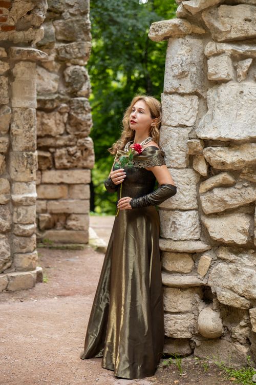 Elegant Woman in Medieval Dress Holding Rose Free Stock Photo Elegant Woman in Medieval Dress Holding Rose Free Stock Photo