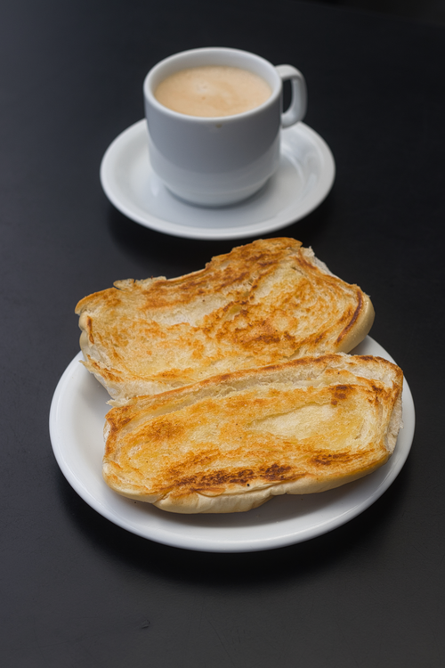 Free Savor a classic Brazilian breakfast with toasted bread and coffee in Manaus, Brazil. Stock Photo