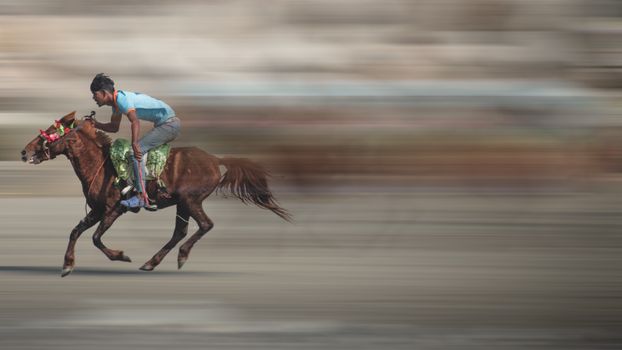 A vibrant image capturing a fast-paced horse race in Chittagong, Bangladesh.