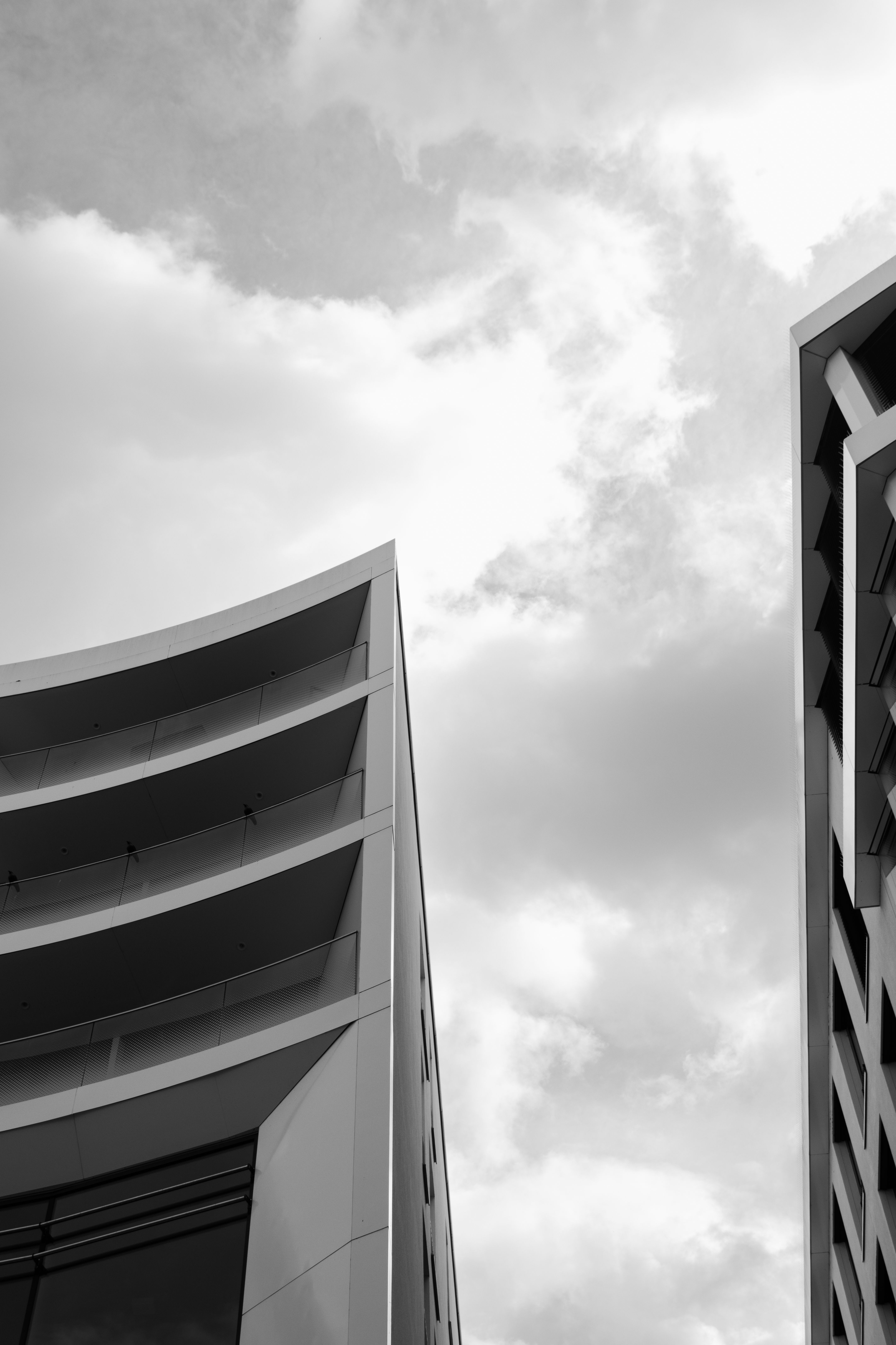 Modern Architectural Skyscrapers Against Cloudy Sky · Free Stock Photo