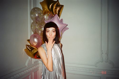 Free Woman Standing With Balloons Behind Stock Photo