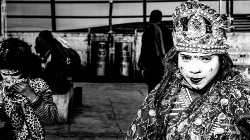 Free Black and white portrait of traditional performer in ornate costume with dramatic makeup and headpiece. Stock Photo