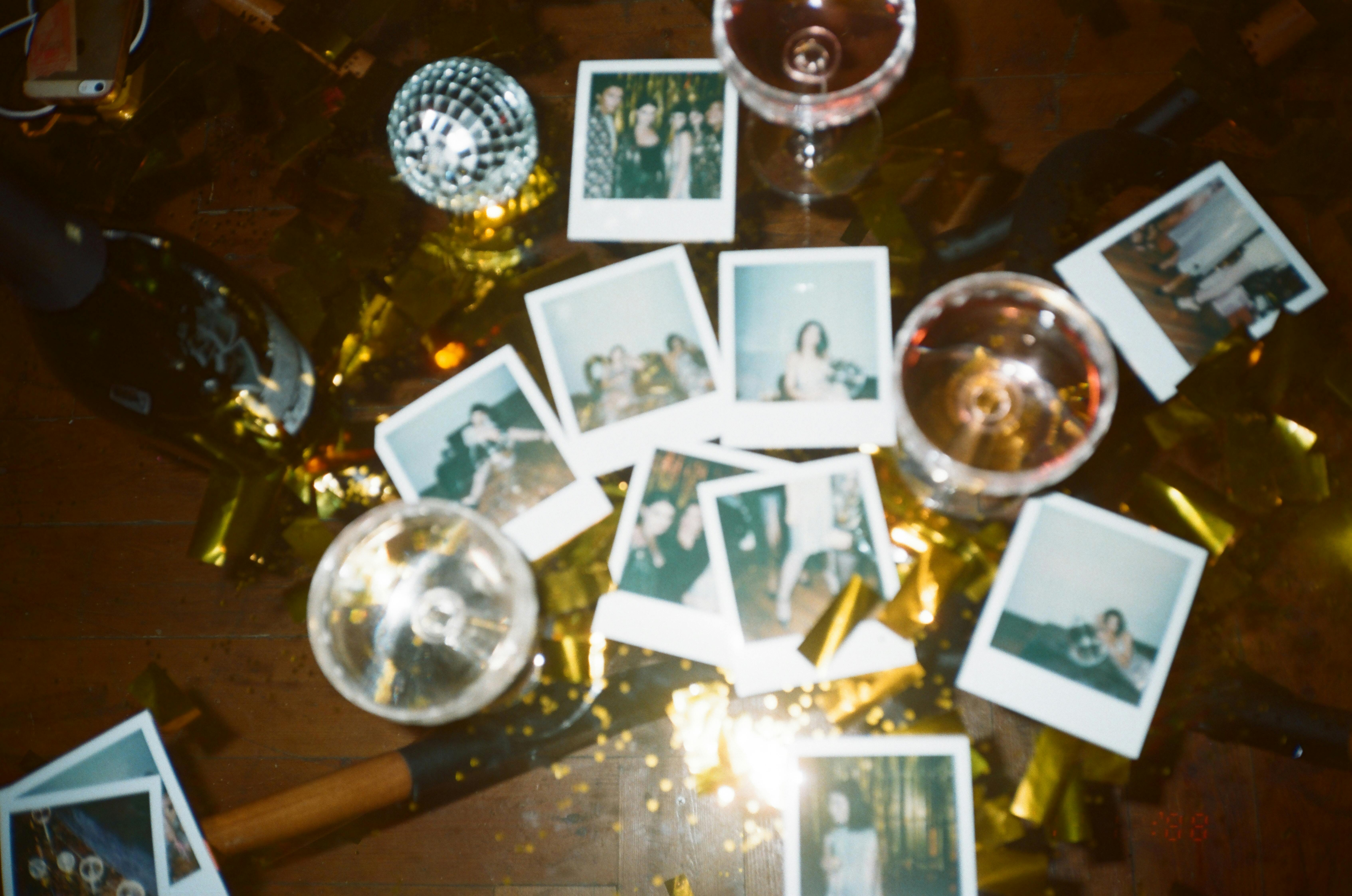 wine glasses and pictures on table