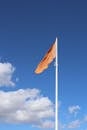 Orange Flag Against a Clear Blue Sky in Cleethorpes