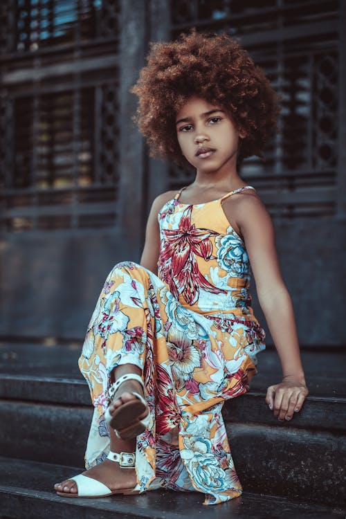 Crossed Leg Girl Sitting on Stairs and Looking at the Camera