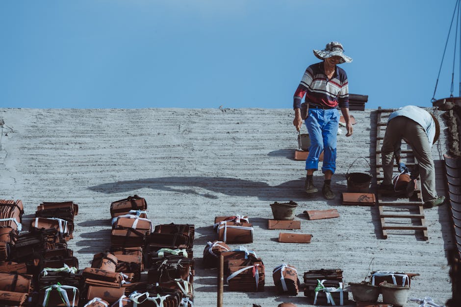 professional roofing team working safely on a roof - roofing installation in medford or professional roofing team working safely on a roof - roofing installation in medford or