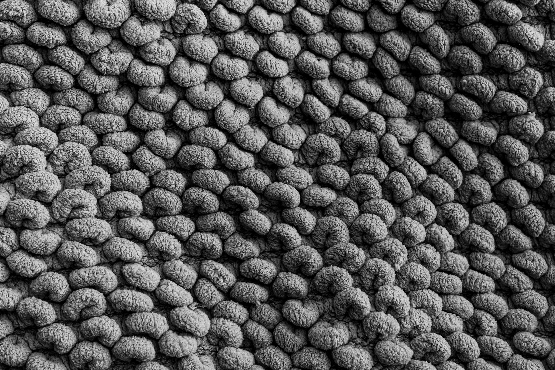 Detailed black and white photo of textured fabric for design background