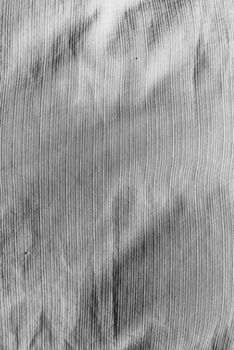 Monochrome abstract texture background with vertical lines and artistic design.