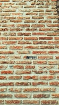 Close-up of a textured brick wall in Amasya reveals intricate patterns and warm tones.