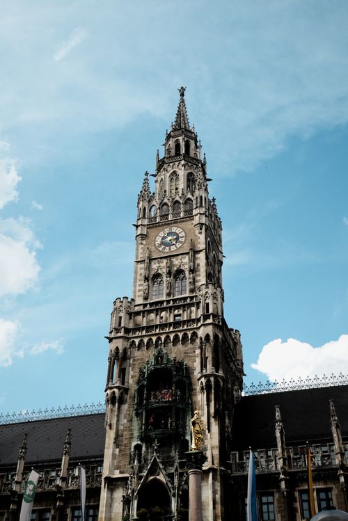 Free Majestic view of Munich's New Town Hall under a bright blue sky. Stock Photo