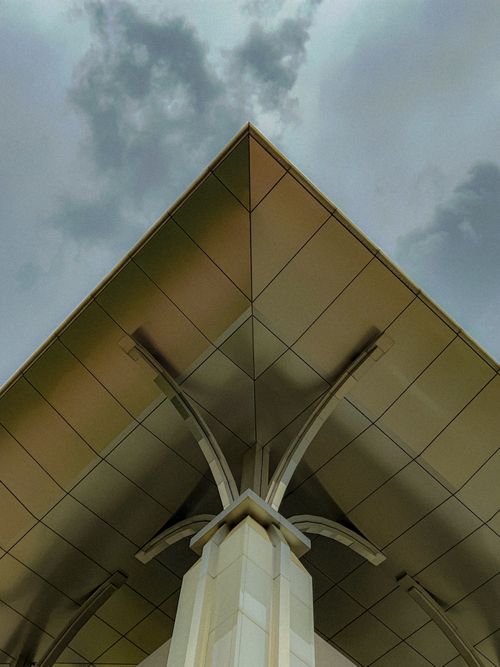 Free Abstract view of a modern architectural roof in Putrajaya, Malaysia on a cloudy day. Stock Photo