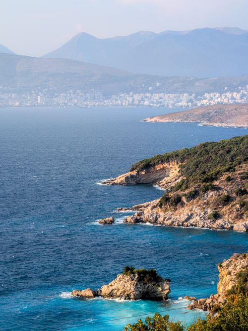 Free A breathtaking aerial view of the Ksamil coastline in Albania with clear blue waters and rugged cliffs. Stock Photo