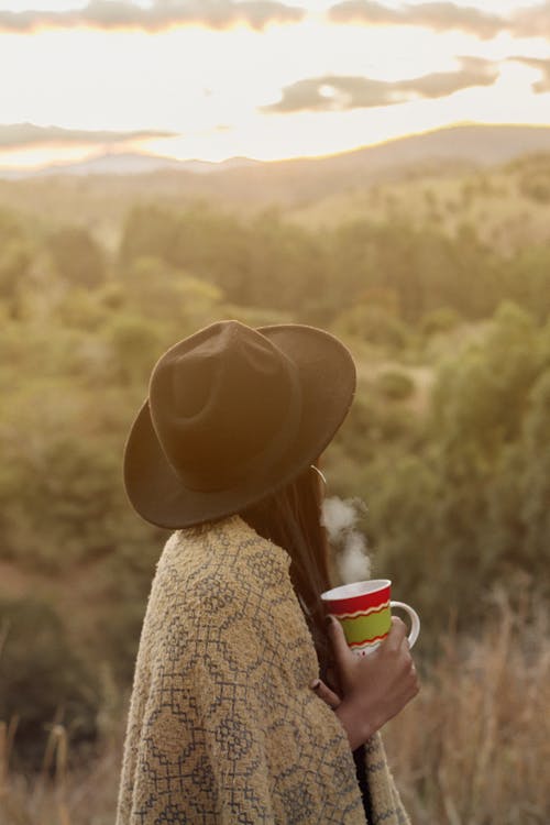 Woman Having Coffee While Looking At The View