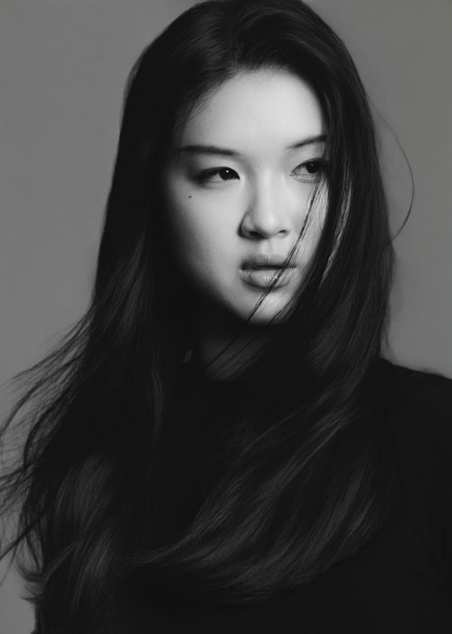 Free Striking black and white portrait capturing the elegance and mood of a young woman. Stock Photo