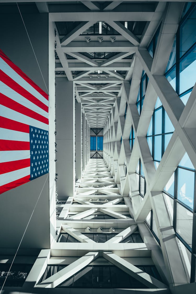 Flag Of America Hanging From A Building