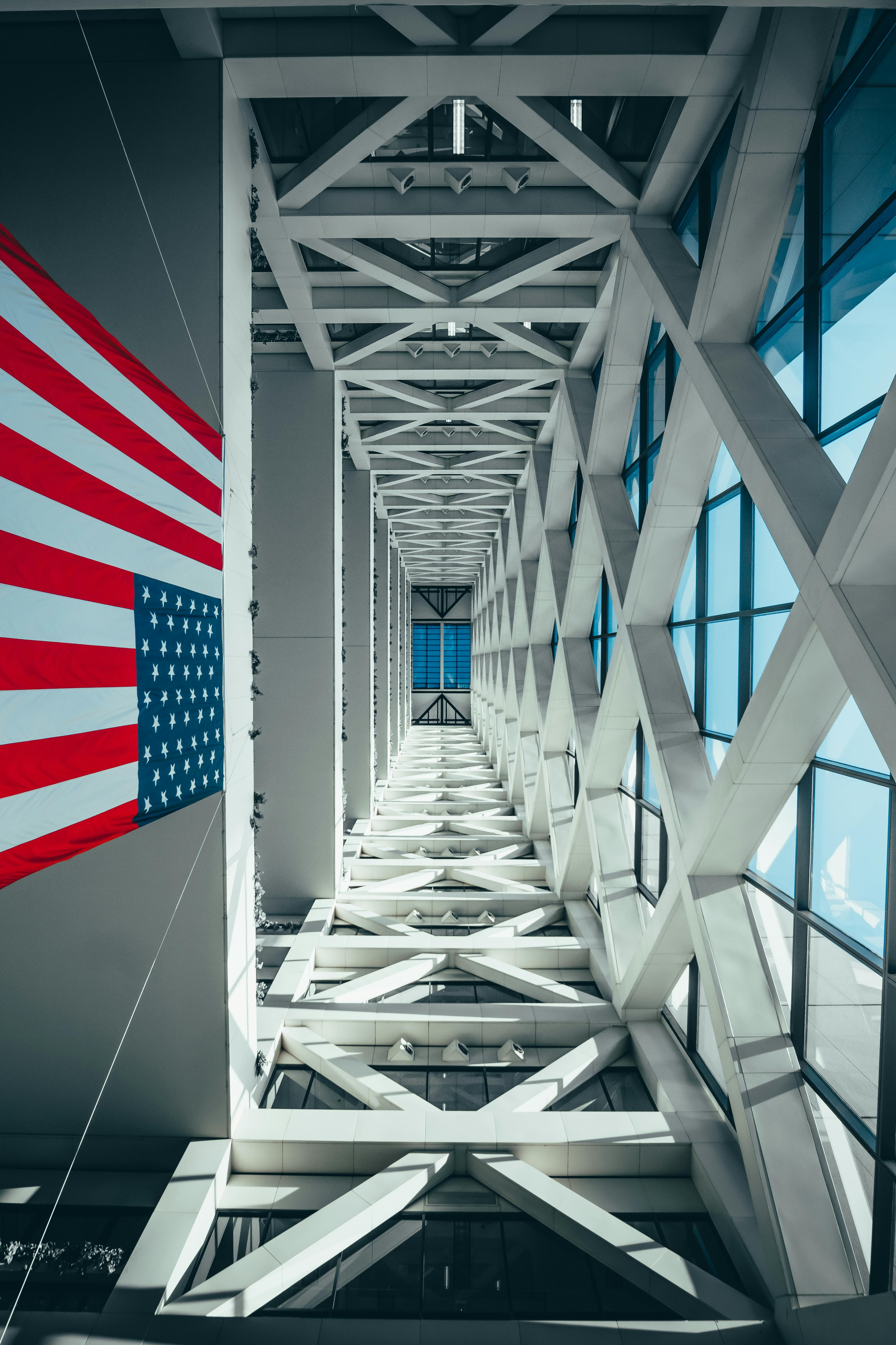 Flag Of America Hanging From A Building Free Stock Photo