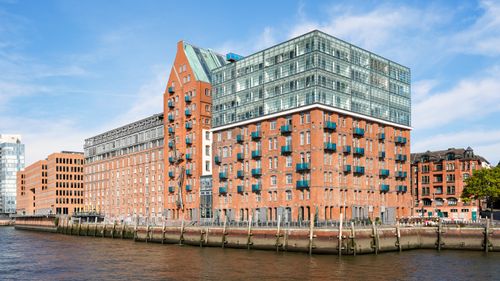 Free Stunning modern and historic architecture along the canal in Hamburg's HafenCity district. Stock Photo