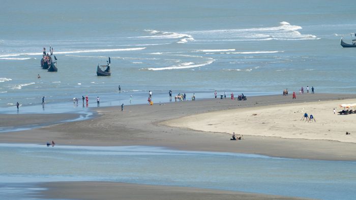 Scenic beach view with boats in Bangladesh
