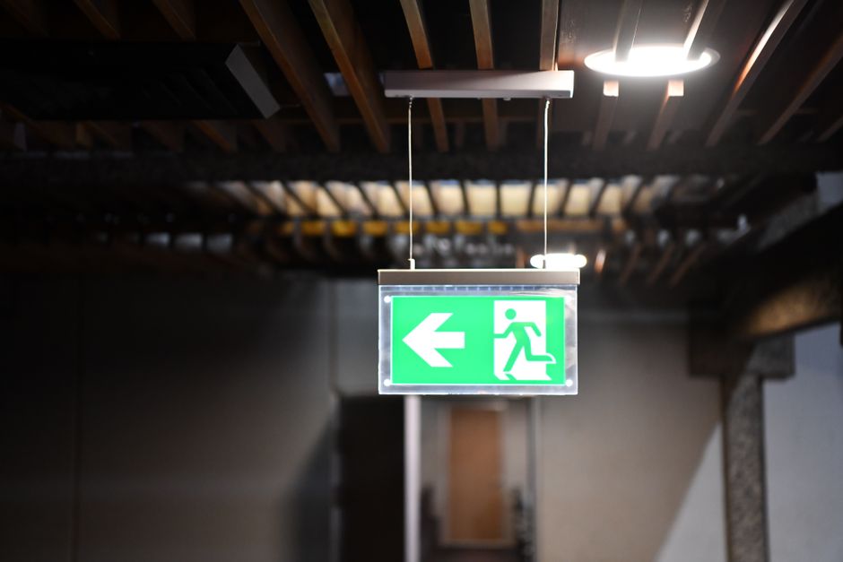 emergency exit sign at crowded venue
